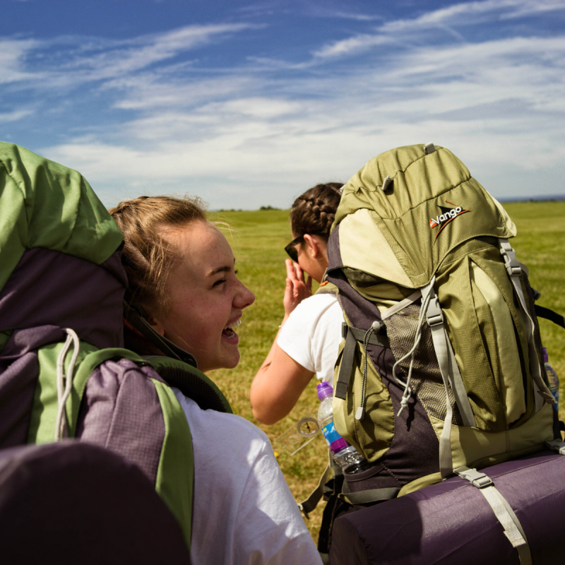 Two female participant on expedition wearing rucksacks